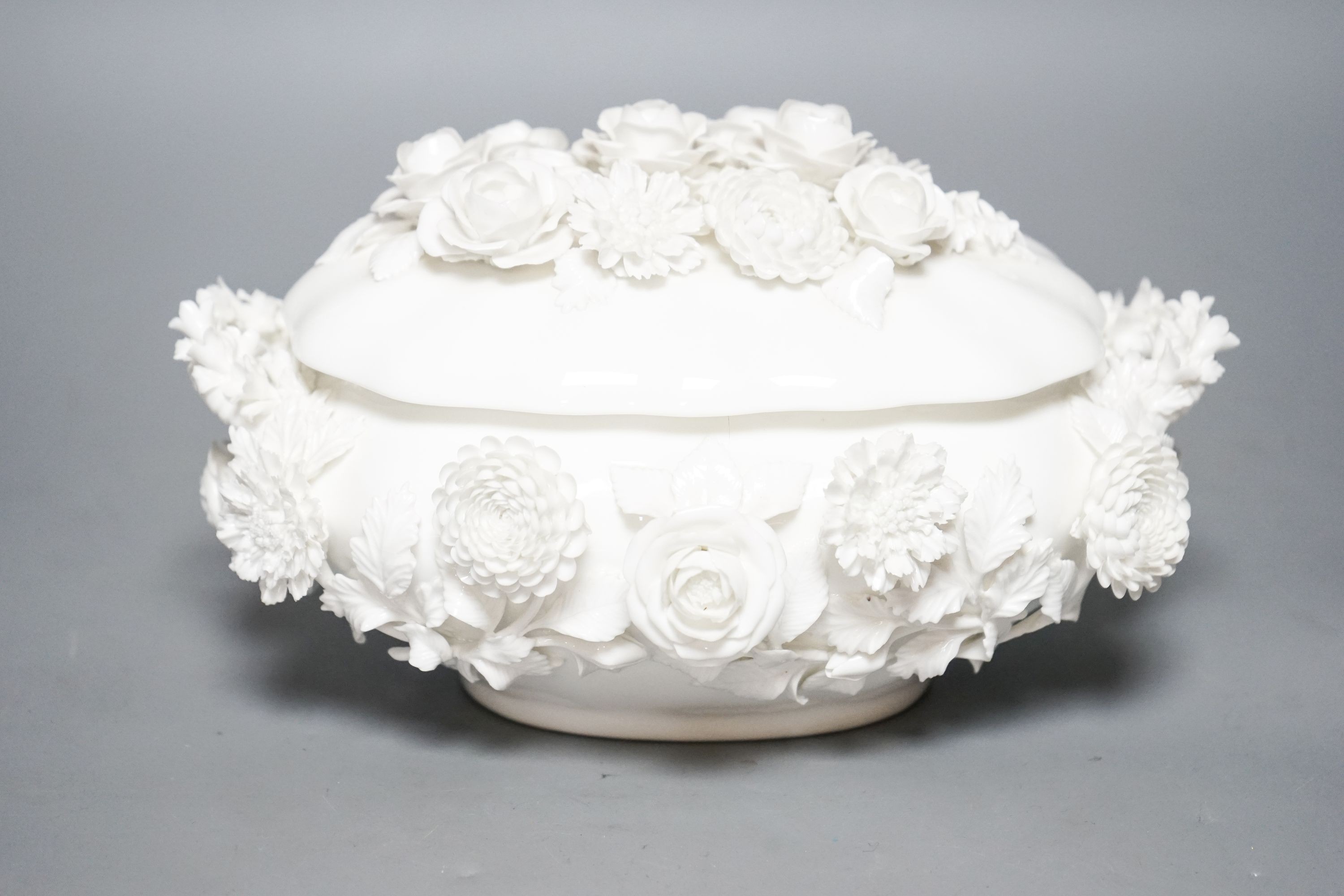 A Coalbrookdale by Coalport white glazed porcelain floral encrusted bowl and cover 23cm